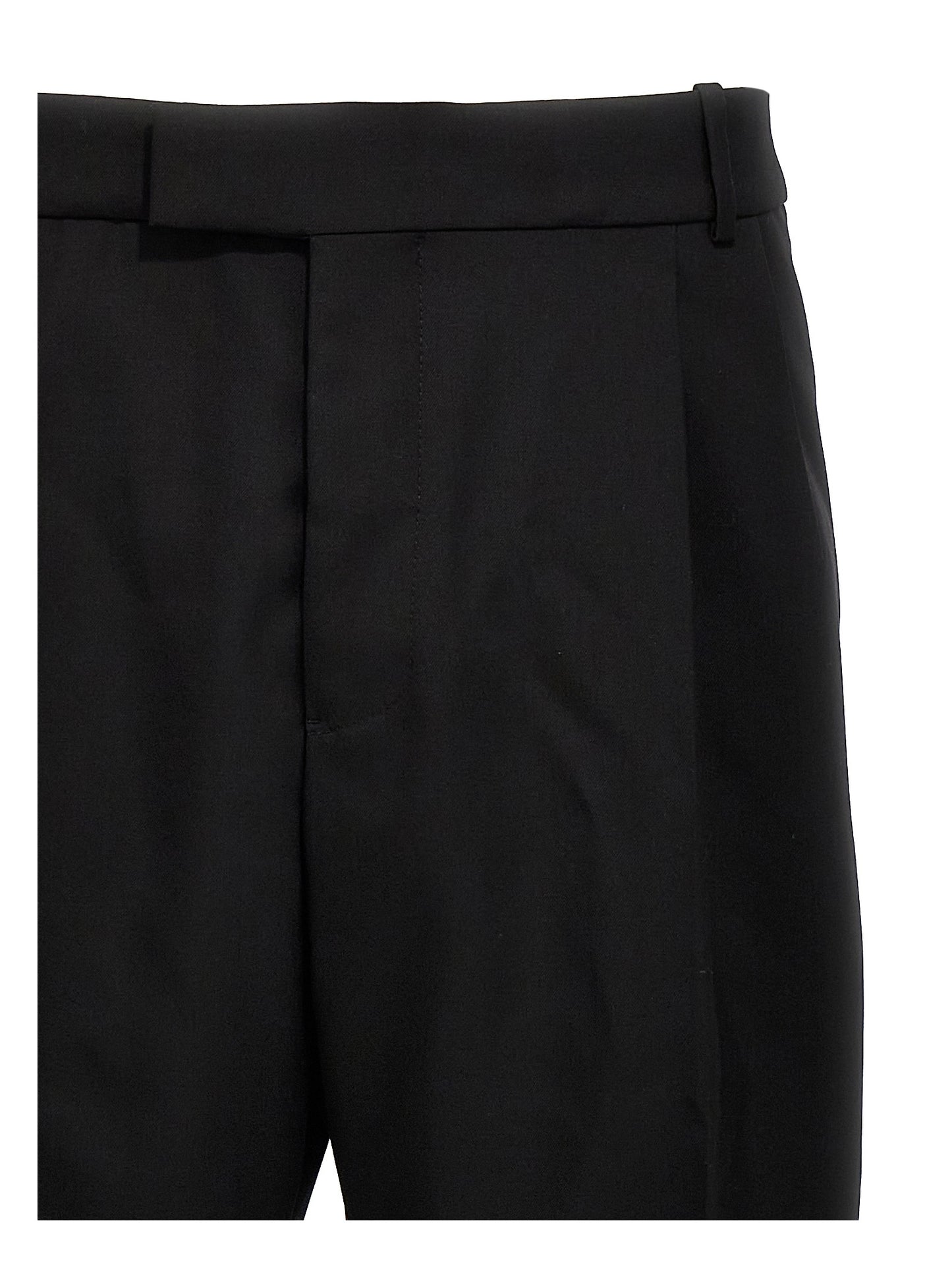 Trousers by Alexander McQueen for men in wool black features a tailored silhouette with a tailored , defined by its long and a sophisticated .