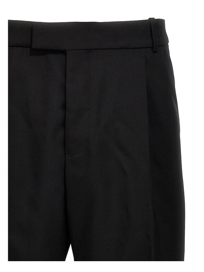 Trousers by Alexander McQueen for men in wool black features a tailored silhouette with a tailored , defined by its long and a sophisticated .