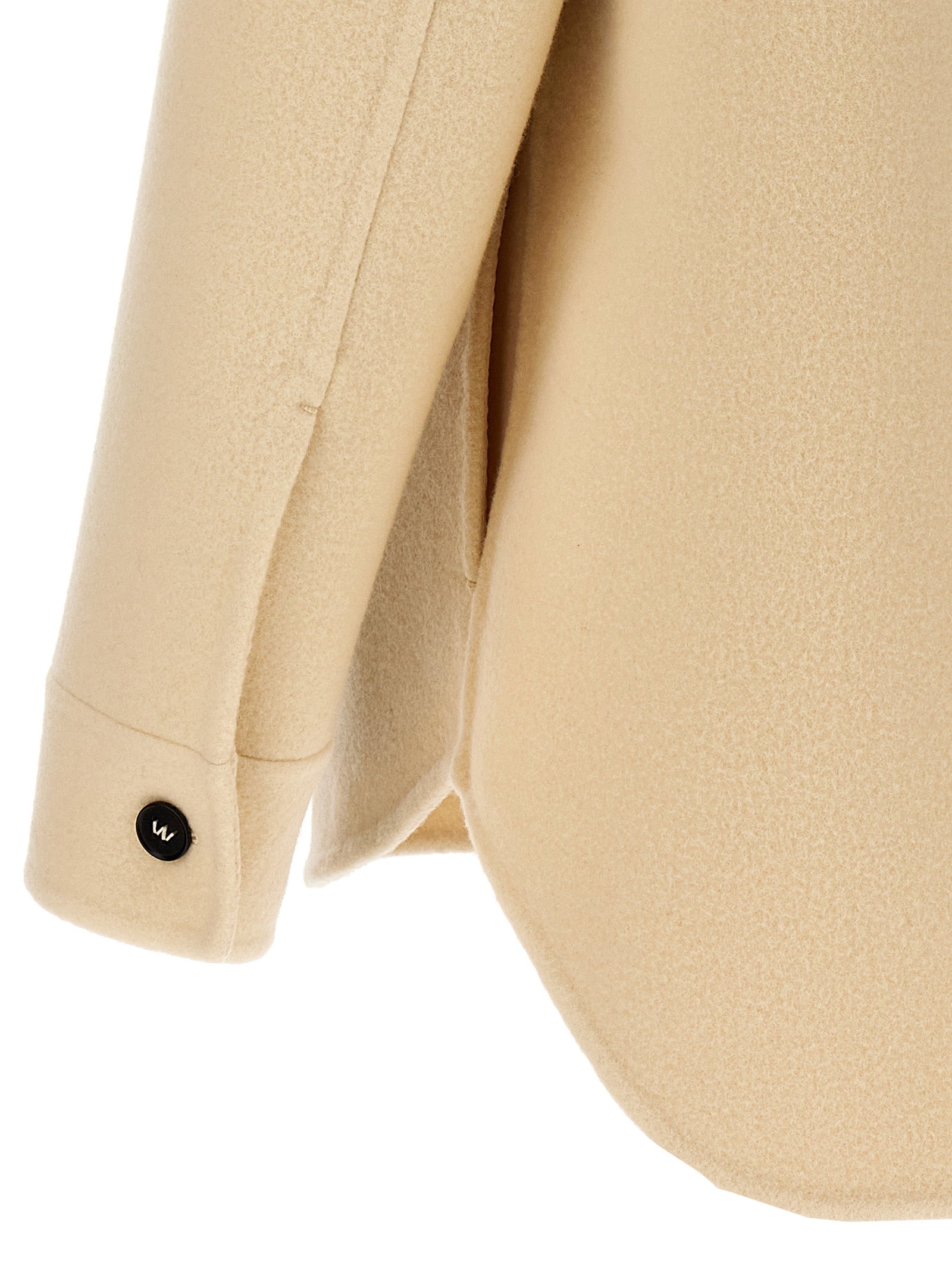 Overcoat by Jil Sander for men in virgin wool beige showcases a enveloping silhouette, detailed with distinctive pockets and a enveloping .
