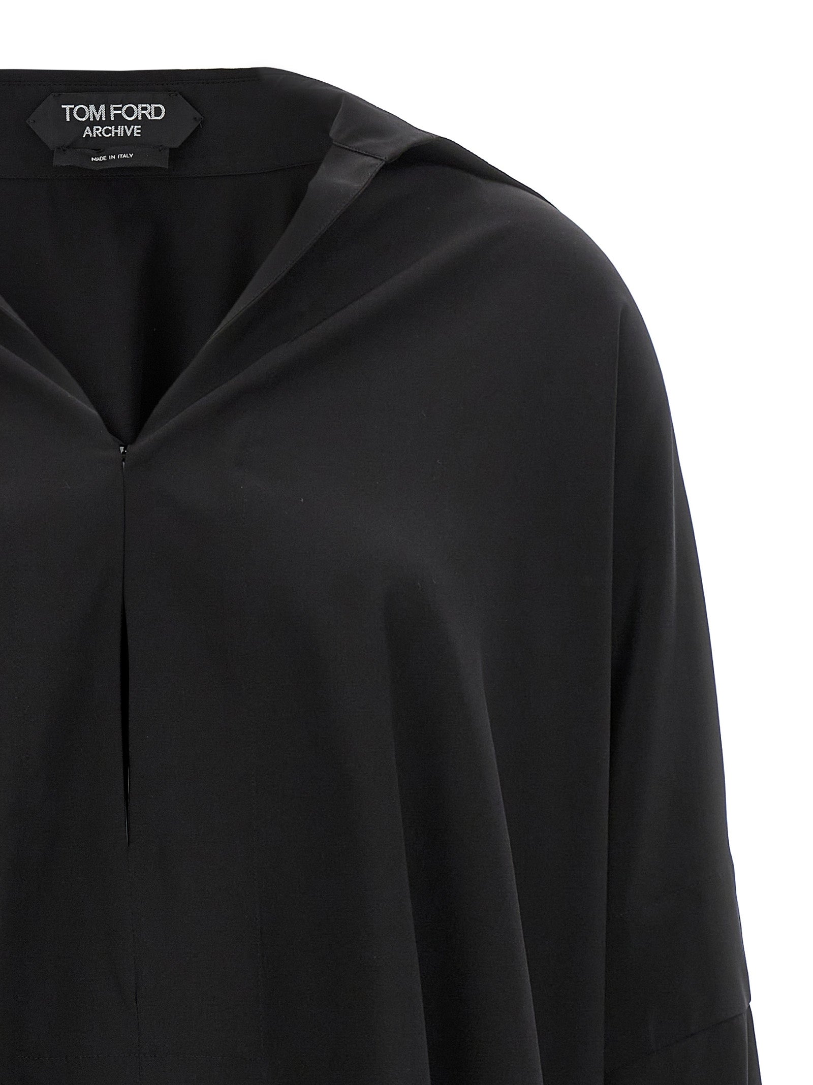Blouse by Tom Ford for women in silk crepe black showcases a sharp silhouette, elegantly detailed with a sharp and sharp .