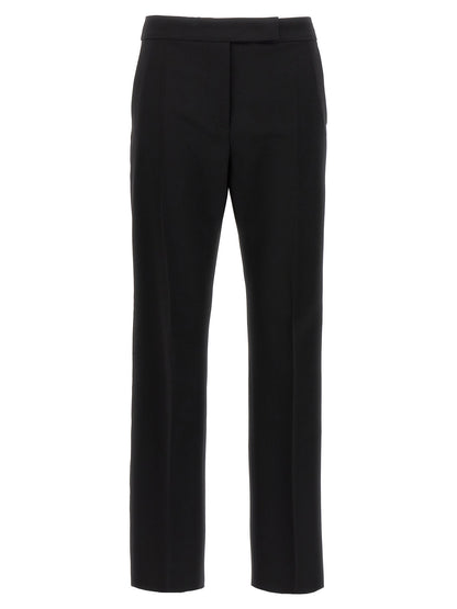 Trousers by Max Mara for women in satin mohair virgin wool black presents a perennial silhouette, meticulously tailored with a cut, long finish, and an elegant .