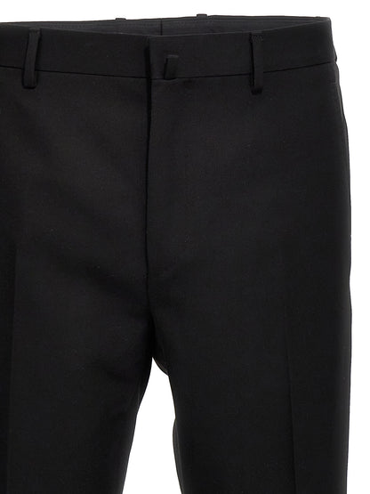 Trousers by Lanvin for men in satin wool black presents a perennial silhouette, meticulously tailored with a cut, long finish, and an elegant .