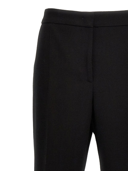 Chinos Pants by Moschino for women in viscose wool crepe black features a modern silhouette, showcasing a modern wide with a long and for a refined finish.