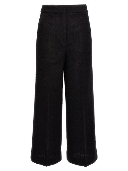 Chinos Pants by Moschino for women in polyamide wool black features an perennial cropped and cropped, expertly tailored with a perennial for a refined silhouette.