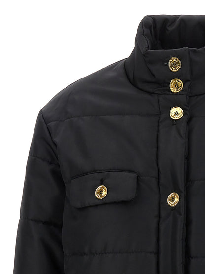 Puffer Jacket by Moschino for women in polyamide black & gold features a dramatic silhouette, showcasing a sophisticated and distinctive insulated for a dramatic aesthetic.