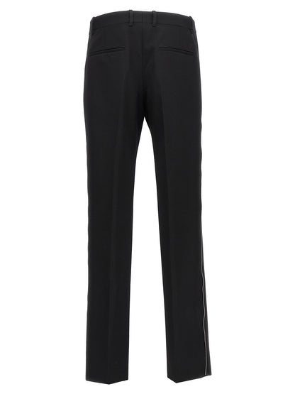Trousers by Off-White for men in virgin wool black & white presents a smart silhouette, meticulously detailed with a smart , a smart long, and a smart .