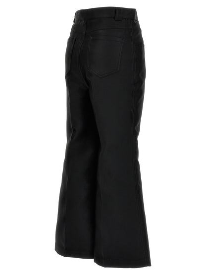 Trousers by Giambattista Valli for women in polyester & silk black presents a perennial silhouette, meticulously tailored with a flared & cropped cut, cropped finish, and an elegant .
