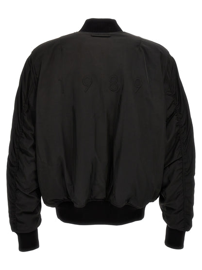 This Bomber Jacket by 1989 Studio for men in nylon & polyester black exhibits a edgy silhouette, meticulously detailed with functional pockets & insulated and a edgy for a edgy finish.
