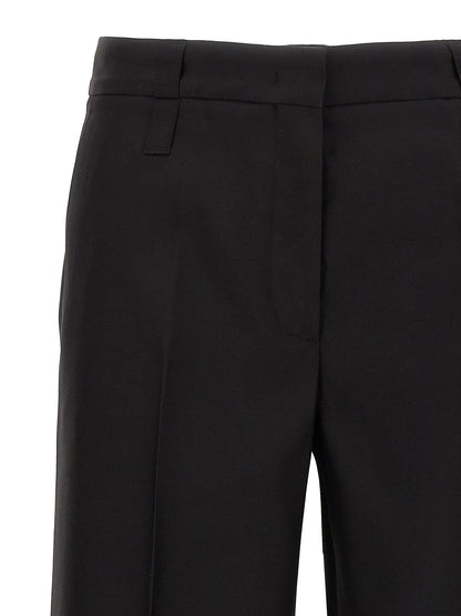 Trousers by CELLAR DOOR for women in virgin wool & silk black features a sculptural silhouette, showcasing a sculptural and long with a sophisticated for a sculptural finish.