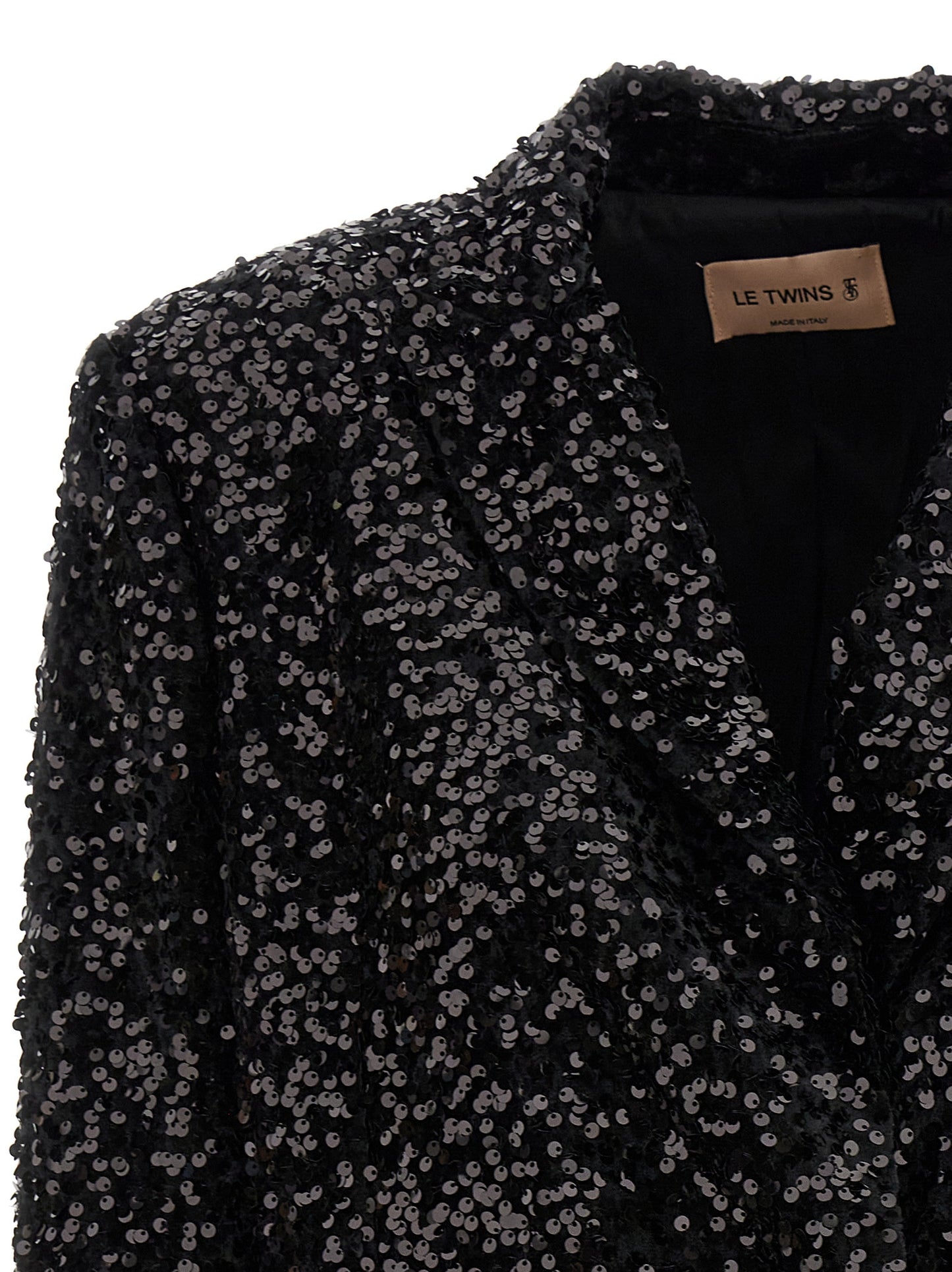 This Blazer by LE TWINS for women in polyester & sequins black presents a tailored silhouette, meticulously tailored with a tailored and distinctive for a tailored finish.