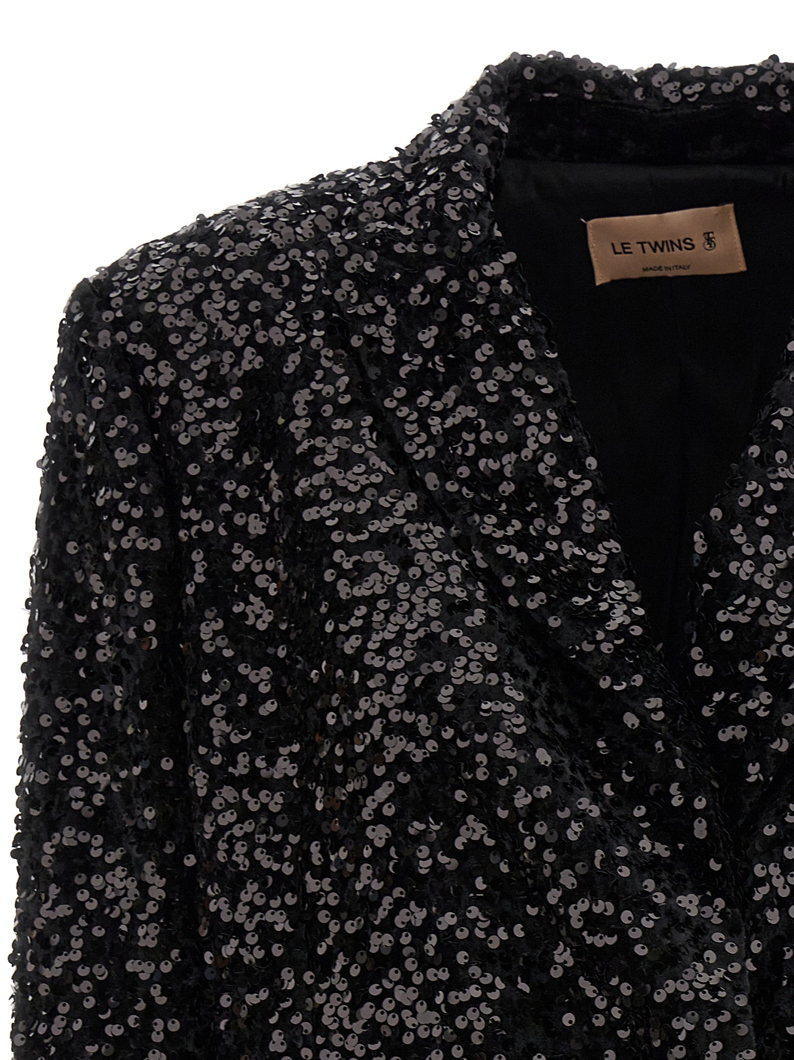 This Blazer by LE TWINS for women in polyester & sequins black presents a tailored silhouette, meticulously tailored with a tailored and distinctive for a tailored finish.