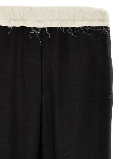 Casual Pants by WALES BONNER for men in wool bicolour, black & white presents a refined pantology silhouette, artfully defined by a refined pantology , long, and a sophisticated .
