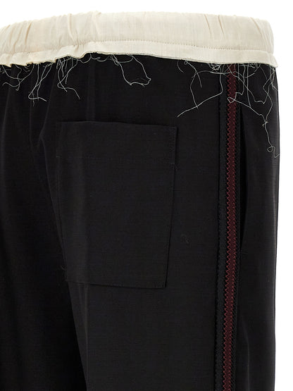 Casual Pants by WALES BONNER for men in wool bicolour, black & white features an sophisticated and with a precise long, creating a sophisticated and sophisticated silhouette.