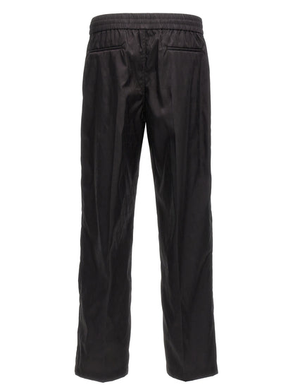 Casual Pants by Valentino Garavani for men in nylon black, patterned & toile features an refined tailoring silhouette, showcasing a premium with a and long cut for a refined tailoring look.