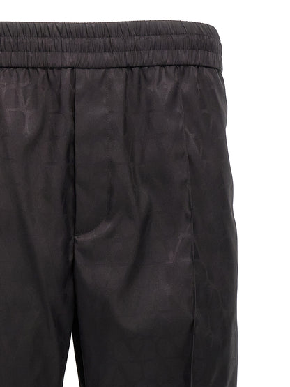 Casual Pants by Valentino Garavani for men in nylon black, patterned & toile features an refined tailoring silhouette, showcasing a premium with a and long cut for a refined tailoring look.