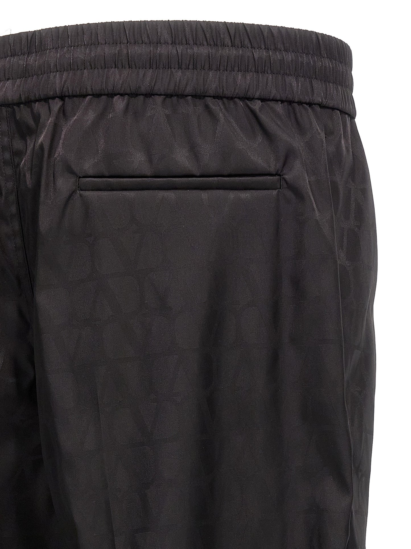Casual Pants by Valentino Garavani for men in nylon black, patterned & toile features an sophisticated and with a precise long, creating a sophisticated and sophisticated silhouette.