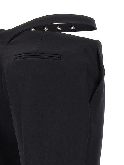 Trousers by The Attico for women in virgin wool black presents a perennial silhouette, meticulously tailored with a slim cut, long finish, and an elegant .