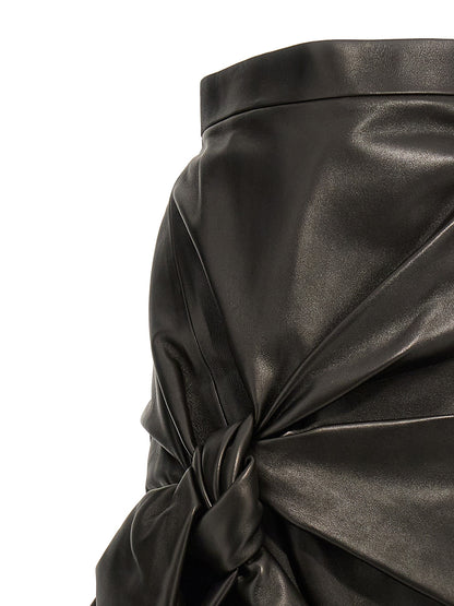 Skirt by Alexander McQueen for women in lamb leather black showcases a sultry silhouette, elegantly defined by its maxi long and the sophisticated sultry design of the Women's High Rise Lamb Leather Maxi Long Skirt.