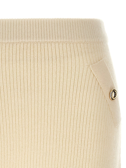 Skirt by Michael Kors for women in cashmere wool & nylon white showcases a sultry silhouette, elegantly defined by its long and the sophisticated sultry design of the Women's Cashmere Wool & Nylon Long Skirt.