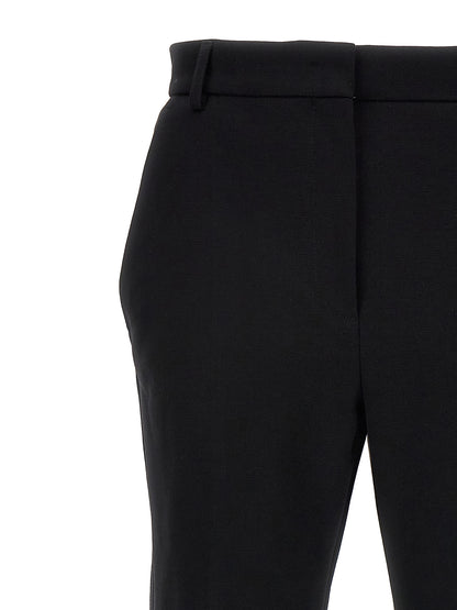 Casual Pants by Sportmax for women in cotton black presents a refined pantology silhouette, artfully defined by a refined pantology , long, and a sophisticated .