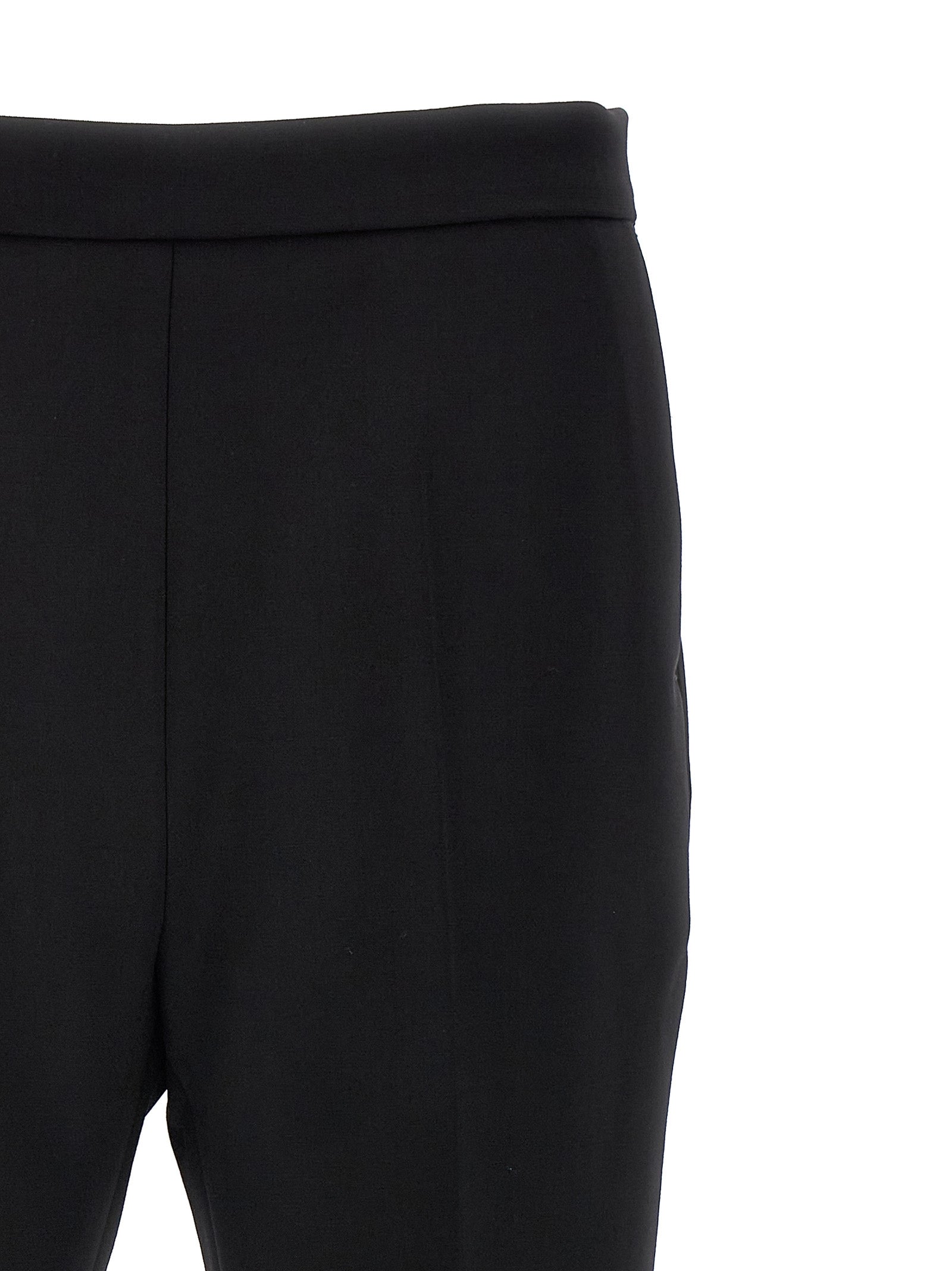 Trousers by Max Mara for women in virgin wool black presents a smart silhouette, meticulously detailed with a smart cropped, a smart cropped, and a smart .
