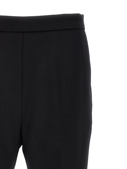 Trousers by Max Mara for women in virgin wool black presents a smart silhouette, meticulously detailed with a smart cropped, a smart cropped, and a smart .