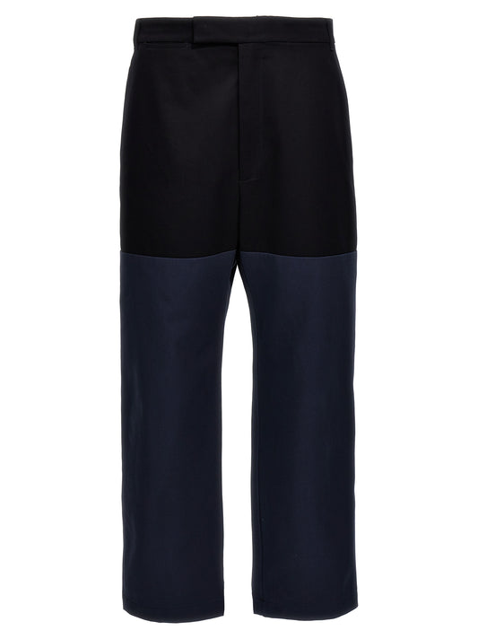 Casual Pants by Thom Browne for men in cotton blue & patchwork features a polished silhouette with a polished straight-leg, reaching a polished long and finished with a polished .