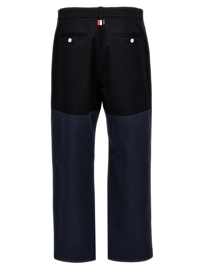 Casual Pants by Thom Browne for men in cotton blue & patchwork presents a tailored silhouette, showcasing a tailored straight-leg and long cut with a refined for a truly tailored aesthetic.