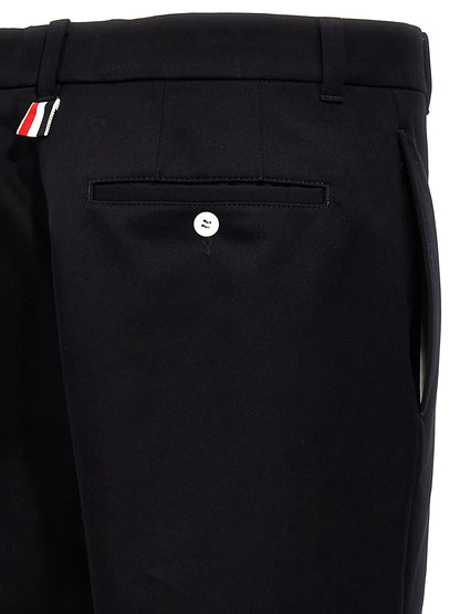Casual Pants by Thom Browne for men in cotton blue & patchwork presents a refined pantology silhouette, artfully defined by a refined pantology straight-leg, long, and a sophisticated .