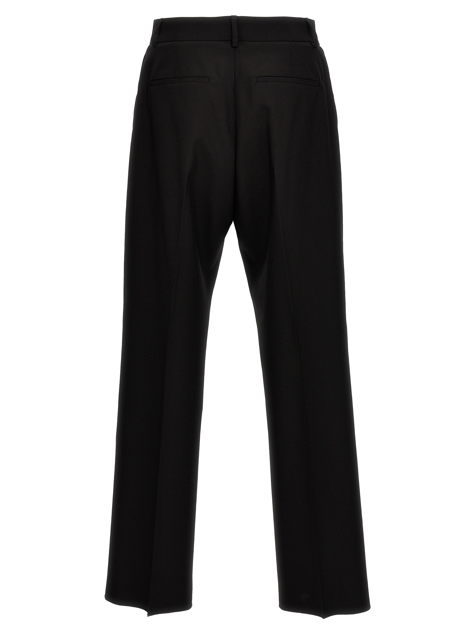 Trousers by Valentino Garavani for men in virgin wool black features a artisanal silhouette, showcasing a sophisticated with a long and for a artisanal finish.