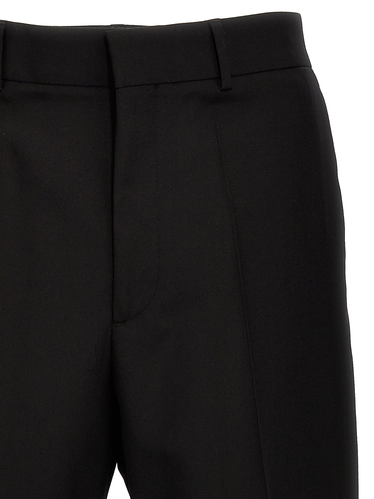Trousers by Valentino Garavani for men in virgin wool black features an on trend silhouette, showcasing a sophisticated with a long and for an on trend finish.