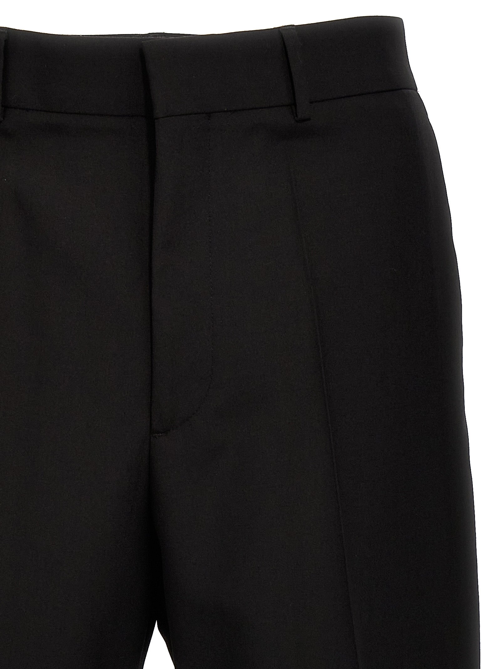 Trousers by Valentino Garavani for men in virgin wool black features an on trend silhouette, showcasing a sophisticated with a long and for an on trend finish.