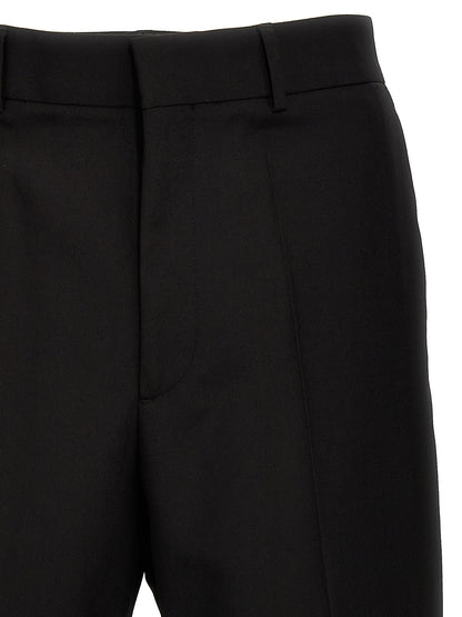 Trousers by Valentino Garavani for men in virgin wool black features an on trend silhouette, showcasing a sophisticated with a long and for an on trend finish.