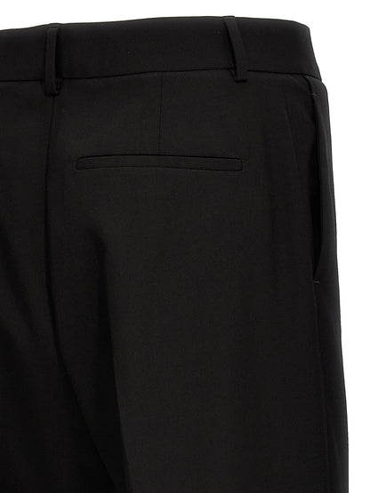 Trousers by Valentino Garavani for men in virgin wool black presents a smart silhouette, meticulously detailed with a smart , a smart long, and a smart .