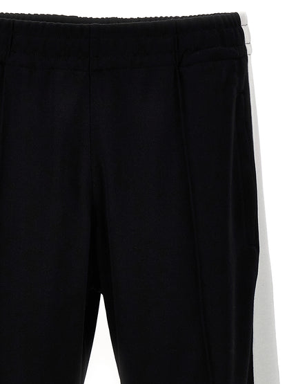 Joggers by Isabel Marant for men in cotton polyester bicolour, black & white presents a refined pantology silhouette, artfully defined by a refined pantology , long, and a sophisticated .