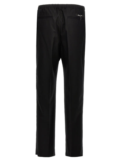 Trousers by Fendi for men in virgin wool black features a artisanal silhouette, showcasing a sophisticated straight with a long and for a artisanal finish.