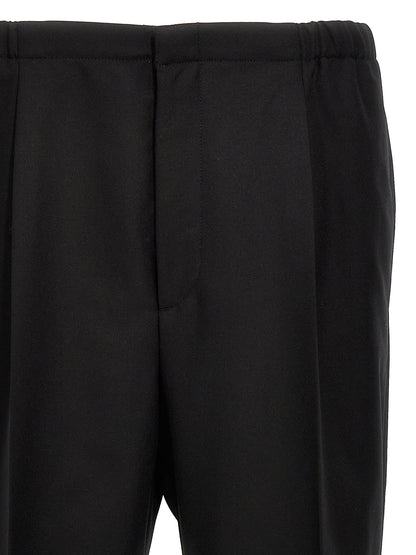 Trousers by Fendi for men in virgin wool black features a tailored silhouette with a tailored straight, defined by its long and a sophisticated .