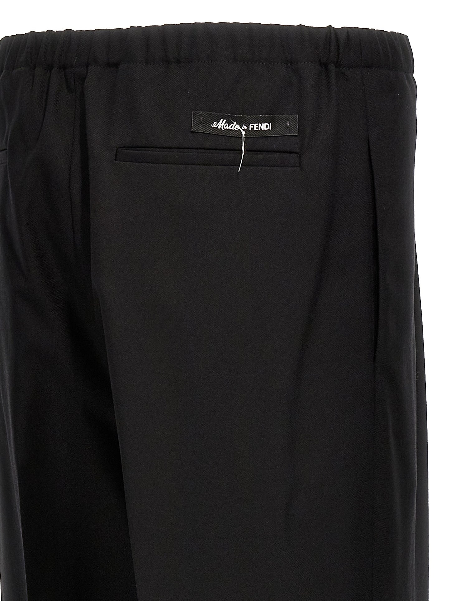 Trousers by Fendi for men in virgin wool black features a artisanal silhouette, showcasing a sophisticated straight with a long and for a artisanal finish.