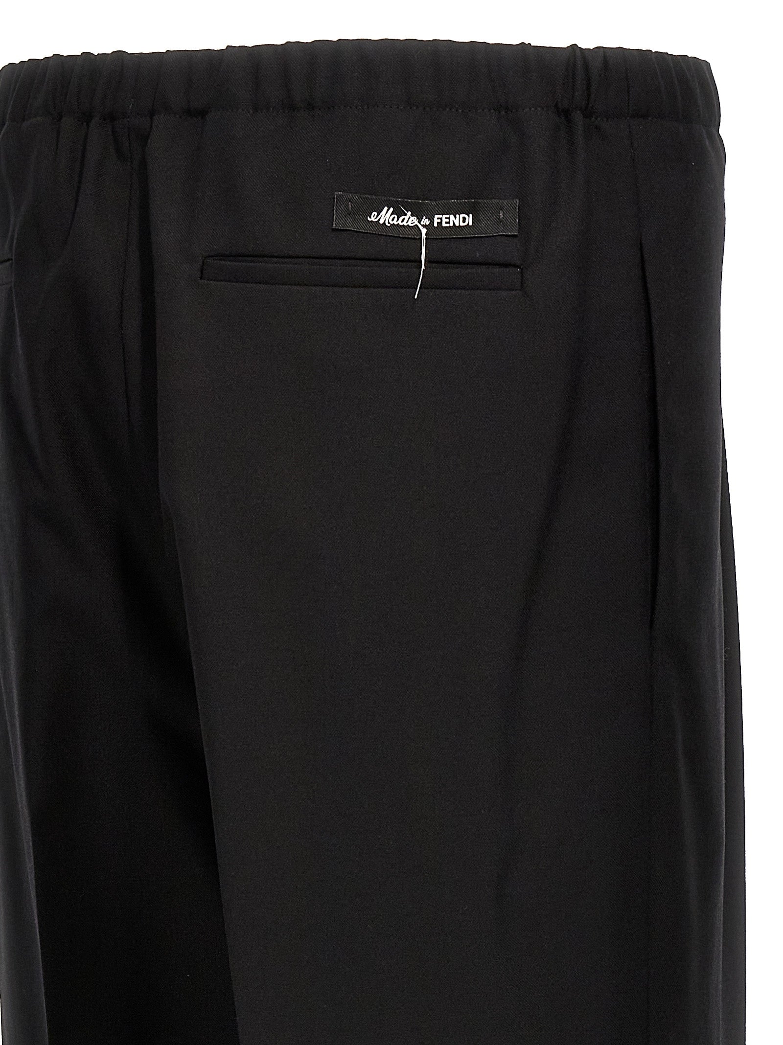 Trousers by Fendi for men in virgin wool black features a artisanal silhouette, showcasing a sophisticated straight with a long and for a artisanal finish.