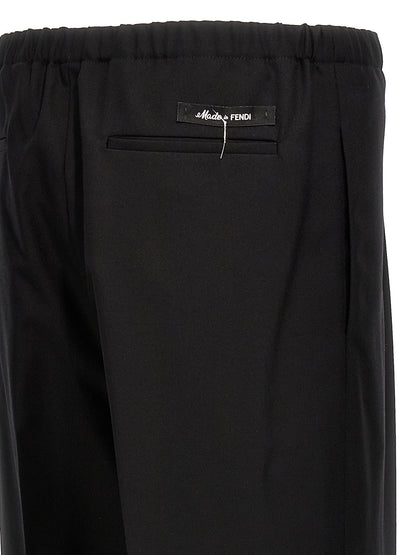 Trousers by Fendi for men in virgin wool black features a artisanal silhouette, showcasing a sophisticated straight with a long and for a artisanal finish.
