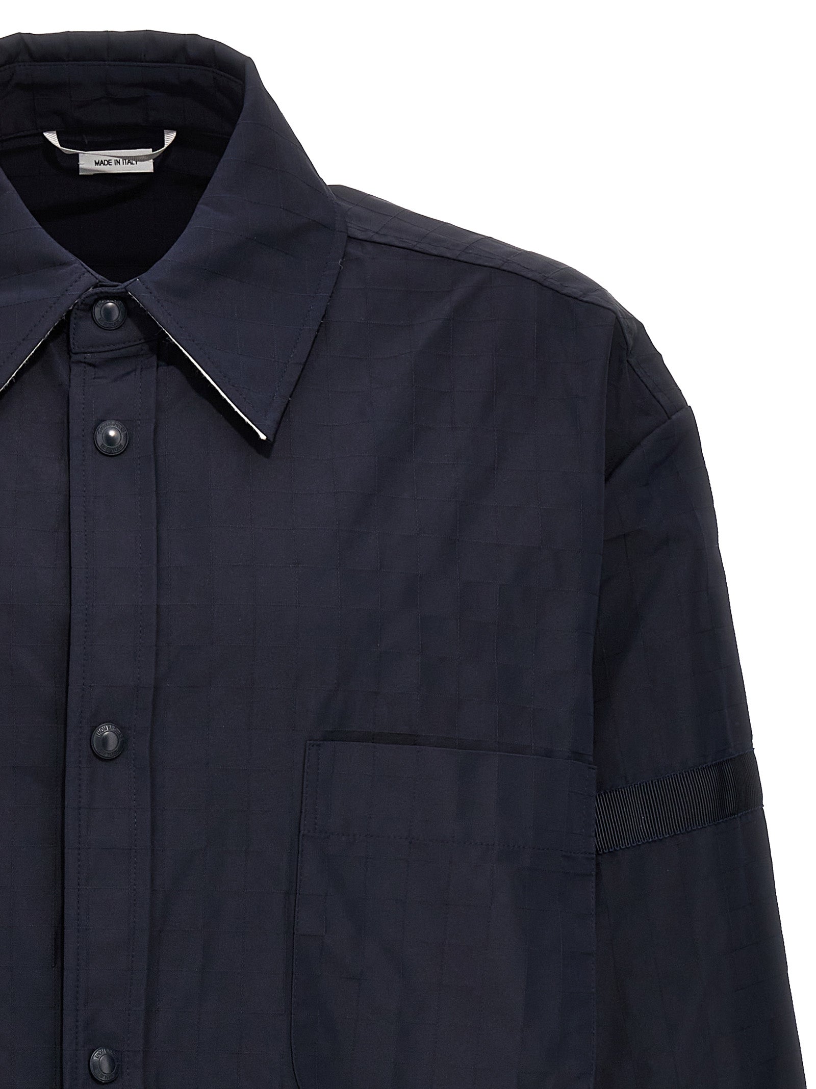 Overshirt by Thom Browne for men in polyamide polyurethane & nylon blue showcases a sublime silhouette, artfully detailed with a sublime and for a sophisticated, sublime finish.