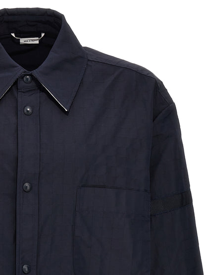 Overshirt by Thom Browne for men in polyamide polyurethane & nylon blue showcases a sublime silhouette, artfully detailed with a sublime and for a sophisticated, sublime finish.