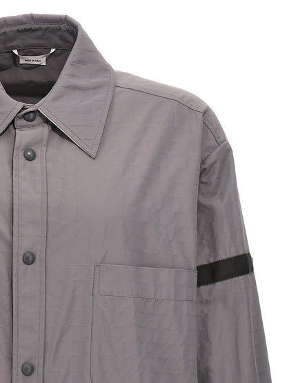 Overshirt by Thom Browne for men in polyamide polyurethane & nylon gray showcases a sublime silhouette, artfully detailed with a sublime and for a sophisticated, sublime finish.