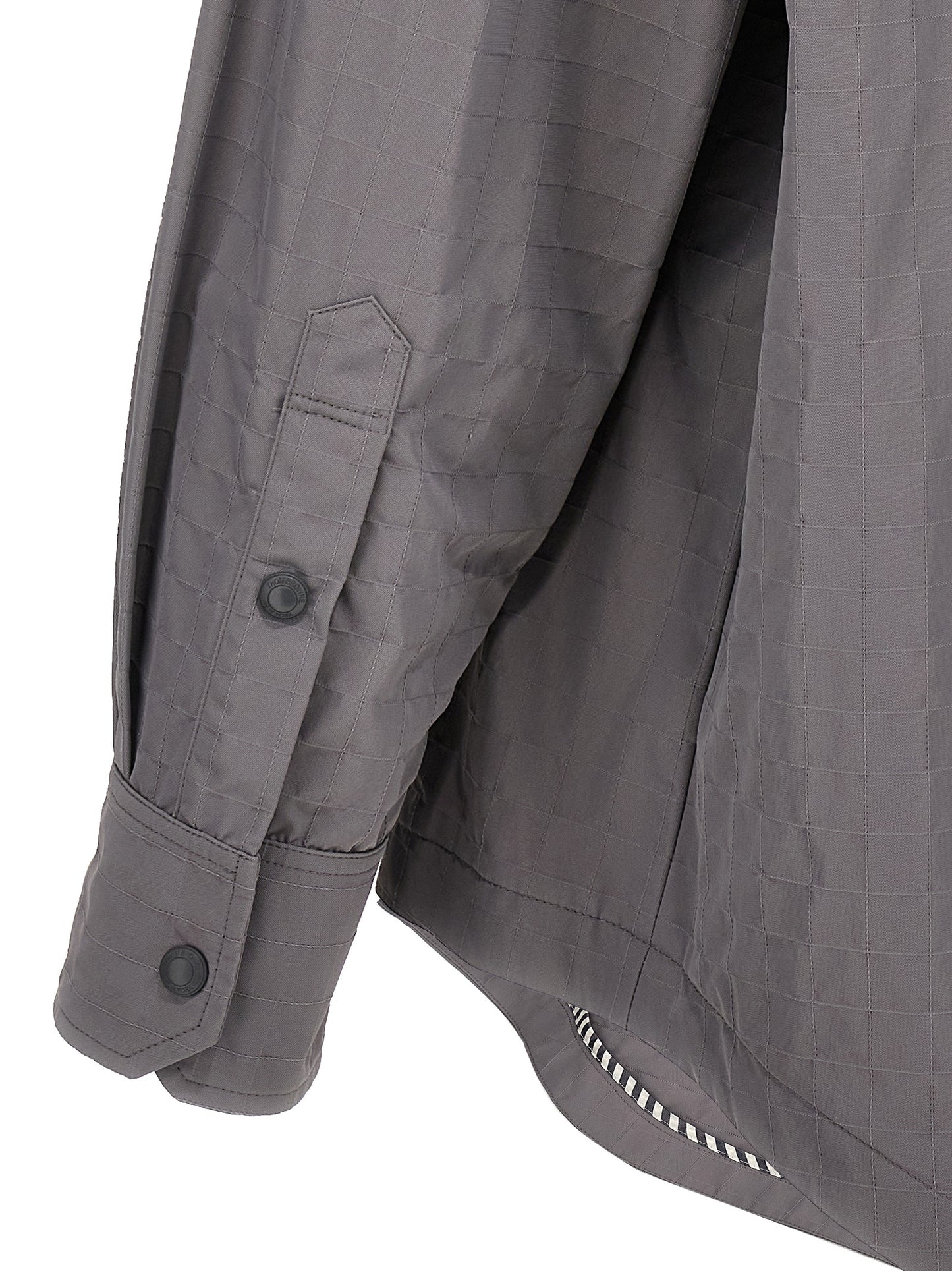 Overshirt by Thom Browne for men in polyamide polyurethane & nylon gray showcases a sleek silhouette, elegantly detailed with a sleek and for a sleek finish.