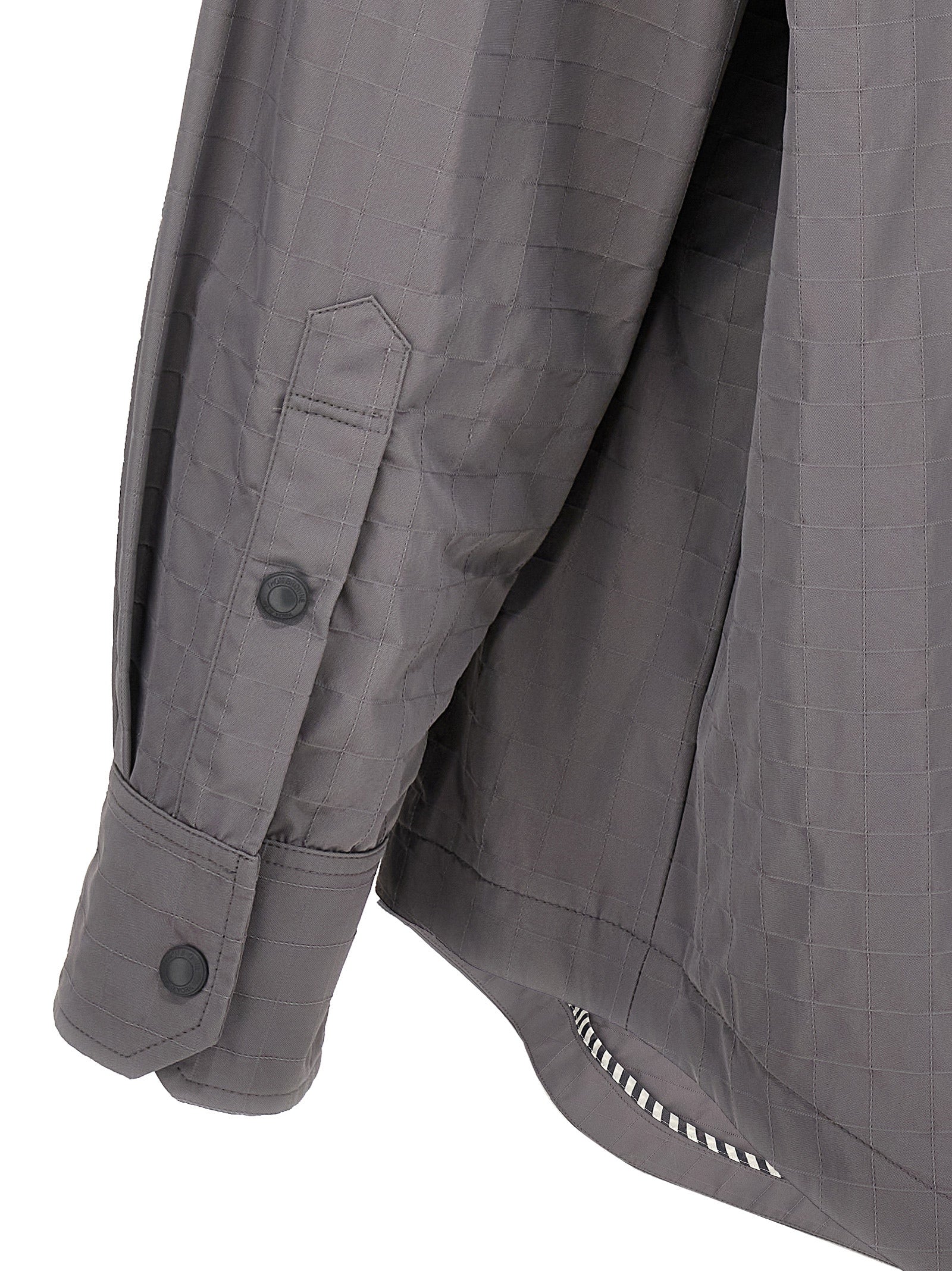 Overshirt by Thom Browne for men in polyamide polyurethane & nylon gray showcases a sleek silhouette, elegantly detailed with a sleek and for a sleek finish.