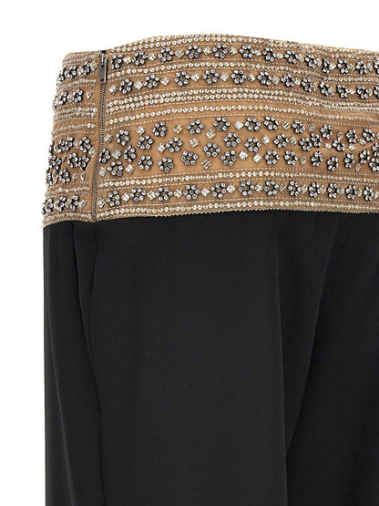 Trousers by Stella McCartney for women in wool mesh & crystal black features a tailored silhouette with a tailored , defined by its long and a sophisticated .