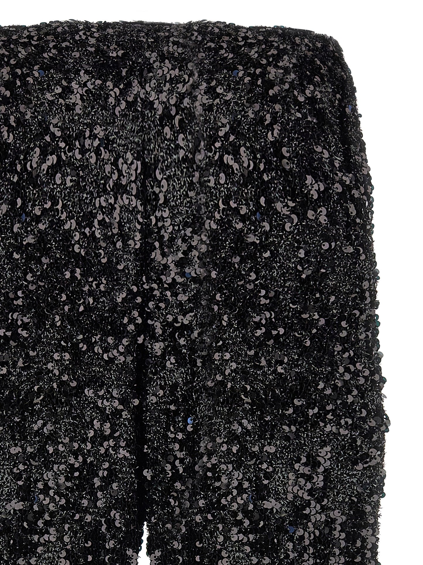 Trousers by LE TWINS for women in polyester & lurex black presents a smart silhouette, meticulously detailed with a smart flared, a smart long, and a smart .