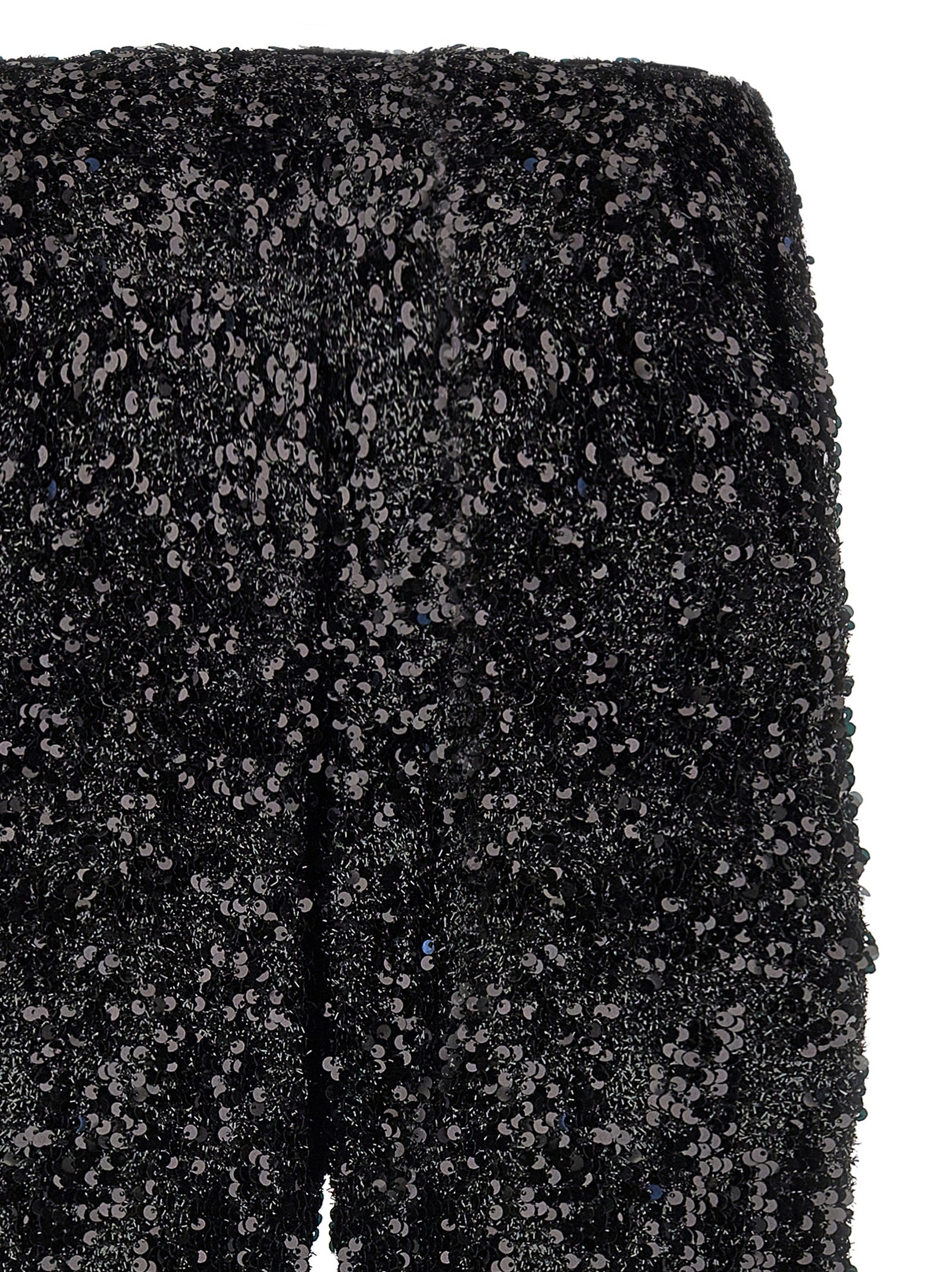 Trousers by LE TWINS for women in polyester & lurex black presents a smart silhouette, meticulously detailed with a smart flared, a smart long, and a smart .