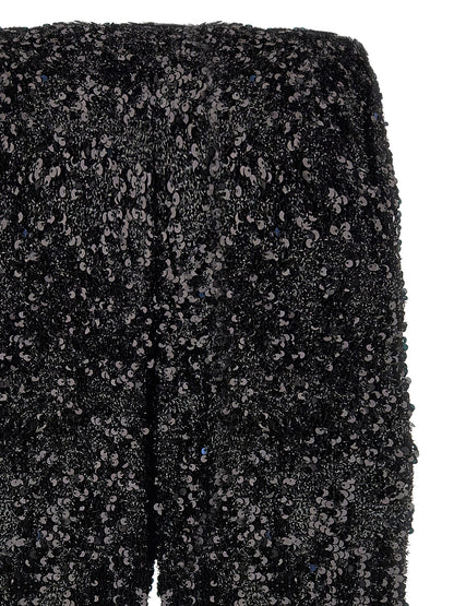 Trousers by LE TWINS for women in polyester & lurex black presents a smart silhouette, meticulously detailed with a smart flared, a smart long, and a smart .