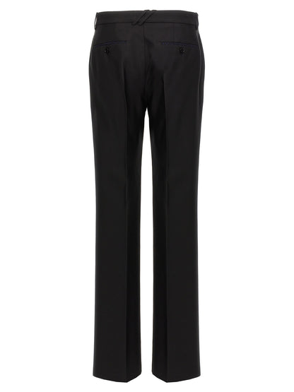 Trousers by Burberry for men in virgin wool & silk black features an sartorial silhouette, showcasing a precise and long with a sartorial for a refined look.